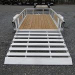 a trailer with a wooden deck and a white ramp