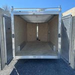 the inside of a trailer with the doors open