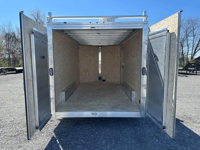 the inside of a trailer with the doors open