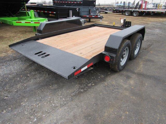 a trailer with a wooden deck is parked in a parking lot