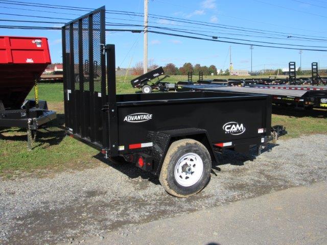 a black trailer is parked in a parking lot