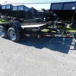 a dump trailer parked in a parking lot