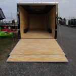 a trailer with the door open and a wooden floor