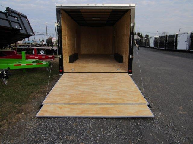 a trailer with the door open and a wooden floor