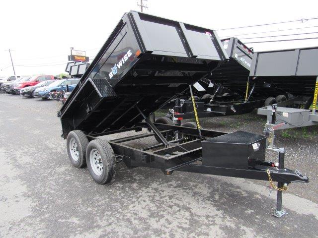 a dump trailer is parked in a parking lot