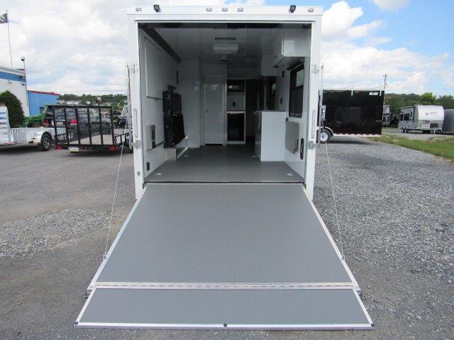 the back of a trailer with the door open and a ramp .