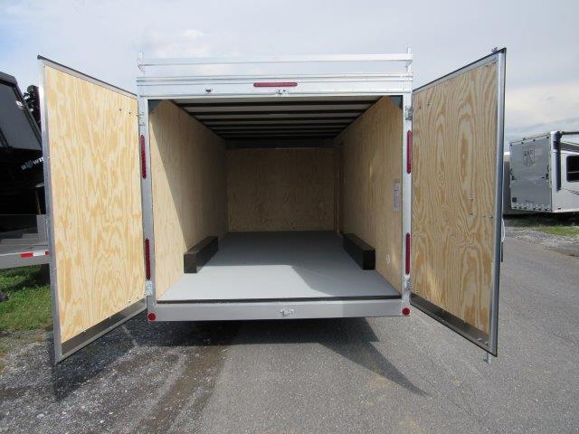 the inside of a trailer with the doors open