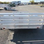 a white trailer is parked in a parking lot