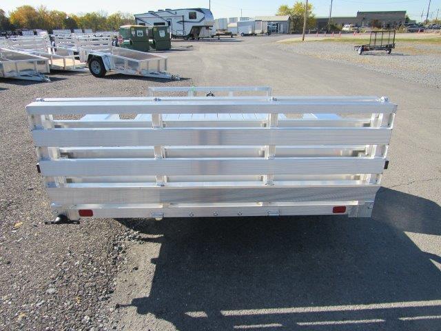 a white trailer is parked in a parking lot