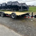 a can trailer is parked on the side of the road