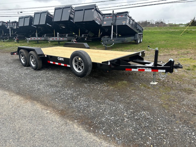 a can trailer is parked on the side of the road