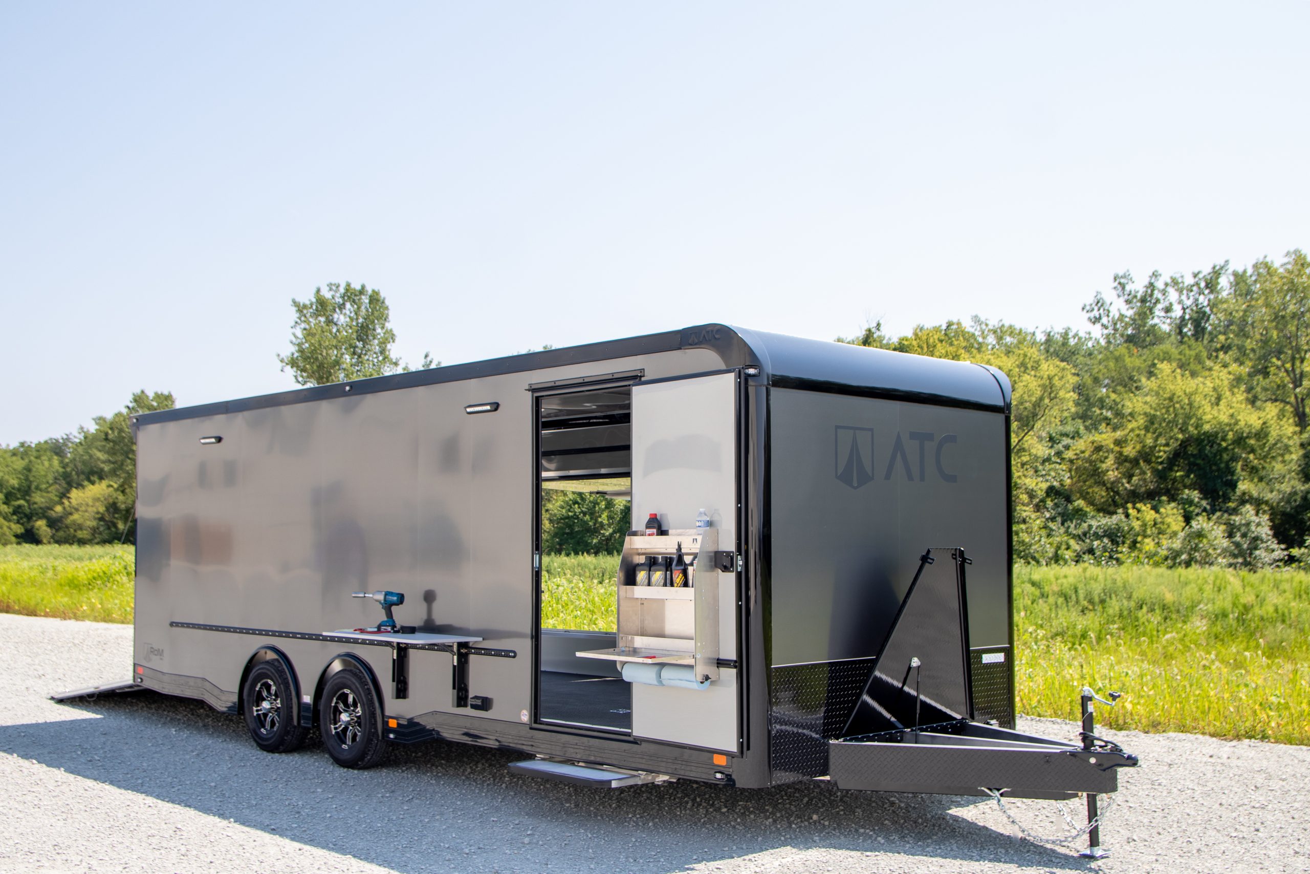 A gray custom enclosed trailer for snowmobiles