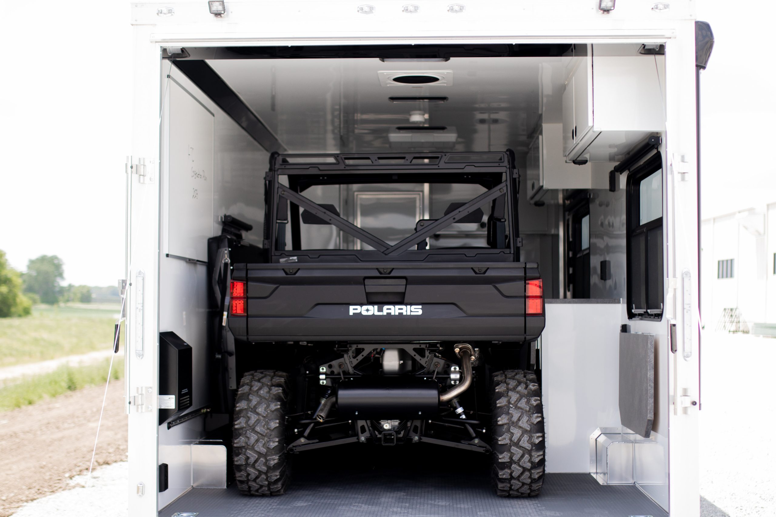 A UTV inside of a custom enclosed trailer